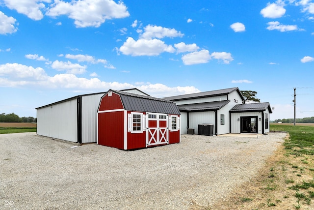 view of outdoor structure with an outbuilding and cooling unit