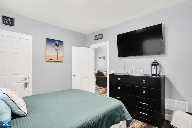bedroom with wood finished floors