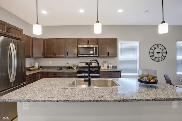 1429 Deloss St, Indianapolis, IN 46201 - kitchen featuring stainless steel appliances, a sink, dark brown cabinets, pendant lighting, and recessed lighting
