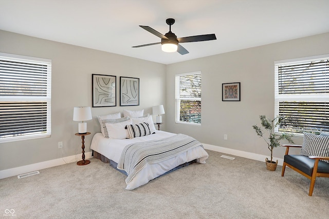 1429 Deloss St, Indianapolis, IN 46201 - bedroom featuring baseboards, light colored carpet, and a ceiling fan