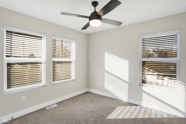 1429 Deloss St, Indianapolis, IN 46201 - carpeted empty room featuring a ceiling fan and baseboards