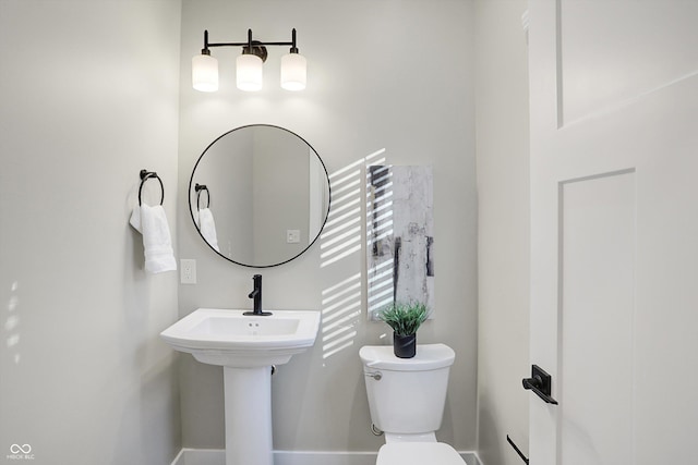 1429 Deloss St, Indianapolis, IN 46201 - half bath featuring toilet and baseboards