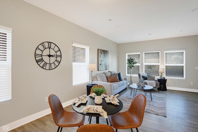 1429 Deloss St, Indianapolis, IN 46201 - dining area featuring plenty of natural light, wood finished floors, and baseboards