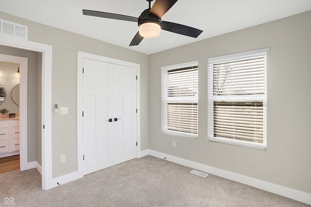 1429 Deloss St, Indianapolis, IN 46201 - unfurnished bedroom with carpet floors, a closet, baseboards, and a ceiling fan