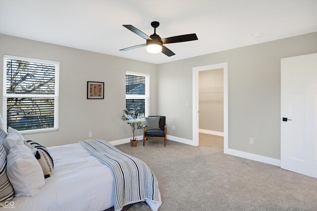 1429 Deloss St, Indianapolis, IN 46201 - bedroom with multiple windows, light carpet, baseboards, and a ceiling fan