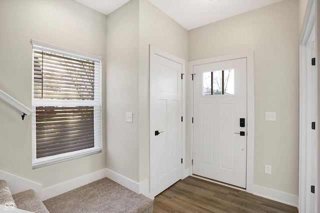 1429 Deloss St, Indianapolis, IN 46201 - foyer with baseboards and dark wood finished floors