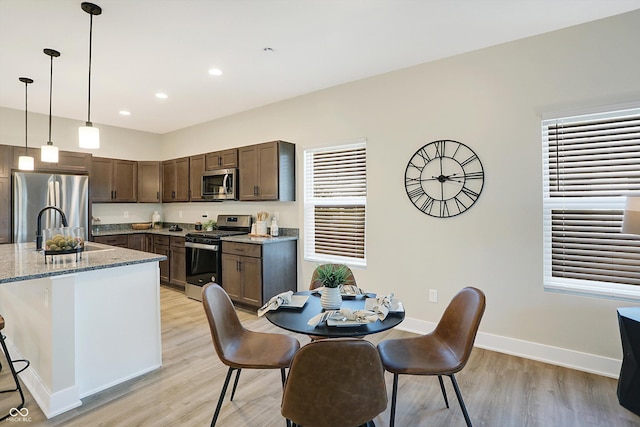1429 Deloss St, Indianapolis, IN 46201 - dining space featuring light wood-style floors, baseboards, and recessed lighting