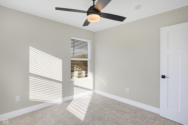 1429 Deloss St, Indianapolis, IN 46201 - spare room with carpet flooring, a ceiling fan, baseboards, and a smoke detector