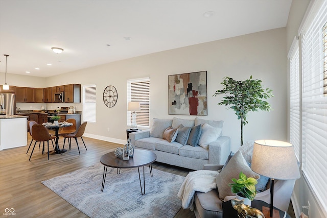 1429 Deloss St, Indianapolis, IN 46201 - living room with light wood-style flooring, baseboards, and recessed lighting
