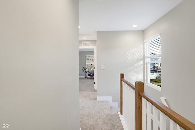 1429 Deloss St, Indianapolis, IN 46201 - hall featuring light carpet, an upstairs landing, recessed lighting, and baseboards