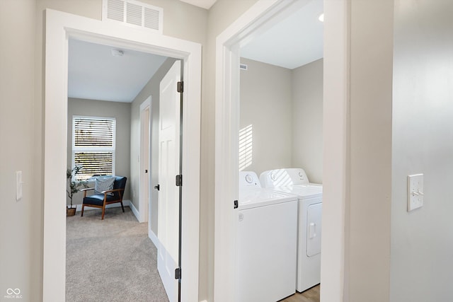 1429 Deloss St, Indianapolis, IN 46201 - washroom featuring washer and clothes dryer, baseboards, and light carpet