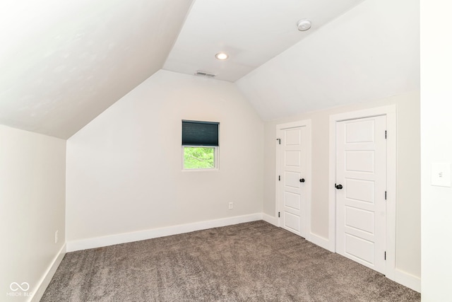 1043 N Beville Ave, Indianapolis, IN 46201 - additional living space with carpet floors, lofted ceiling, and baseboards