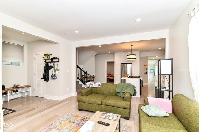 1043 N Beville Ave, Indianapolis, IN 46201 - living area with stairway, light wood-style flooring, recessed lighting, and baseboards