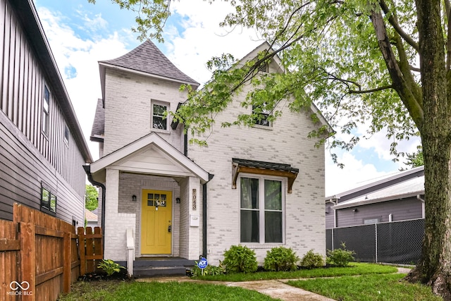 1043 N Beville Ave, Indianapolis, IN 46201 - view of front of home featuring brick siding and a shingled roof