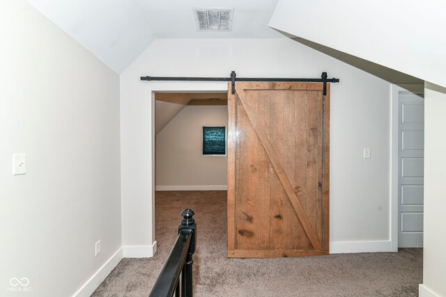 1043 N Beville Ave, Indianapolis, IN 46201 - bonus room with carpet, lofted ceiling, baseboards, and a barn door