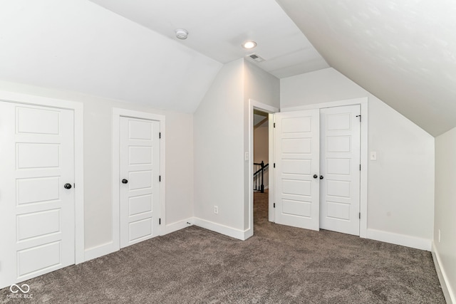 1043 N Beville Ave, Indianapolis, IN 46201 - bonus room featuring dark carpet, vaulted ceiling, and baseboards