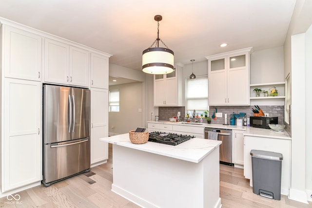 1043 N Beville Ave, Indianapolis, IN 46201 - kitchen featuring appliances with stainless steel finishes, open shelves, a sink, white cabinetry, and recessed lighting