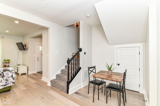 1043 N Beville Ave, Indianapolis, IN 46201 - dining space featuring light wood-type flooring, stairs, baseboards, and recessed lighting