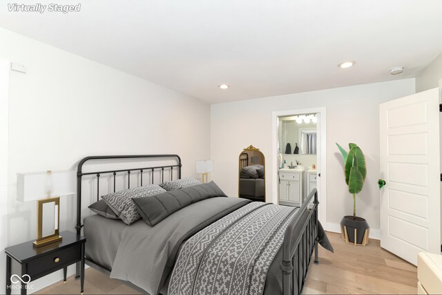 1043 N Beville Ave, Indianapolis, IN 46201 - bedroom with light wood finished floors, recessed lighting, and ensuite bath