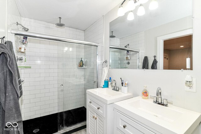 1043 N Beville Ave, Indianapolis, IN 46201 - bathroom with a stall shower and two vanities
