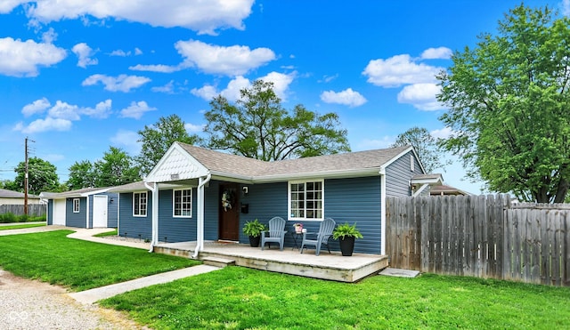 single story home featuring a deck, a garage, and driveway