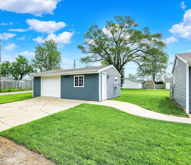 view of outdoor structure with an outdoor structure and concrete driveway