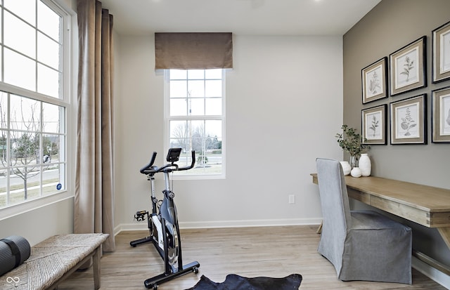 7239 Barrett Dr, Brownsburg, IN 46112 - workout area with light wood-style flooring and baseboards