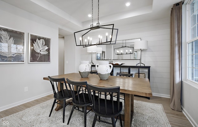7239 Barrett Dr, Brownsburg, IN 46112 - dining area with a chandelier, wood finished floors, a raised ceiling, and recessed lighting