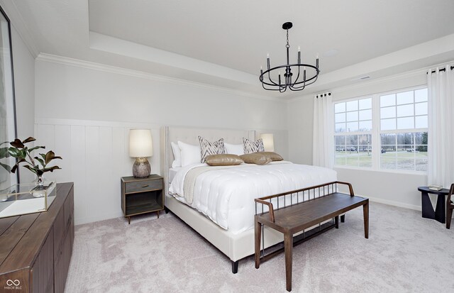 7239 Barrett Dr, Brownsburg, IN 46112 - bedroom with a chandelier, a raised ceiling, light colored carpet, wainscoting, and ornamental molding