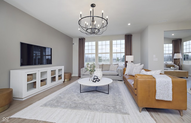 7239 Barrett Dr, Brownsburg, IN 46112 - living area featuring light wood finished floors, a chandelier, recessed lighting, and baseboards