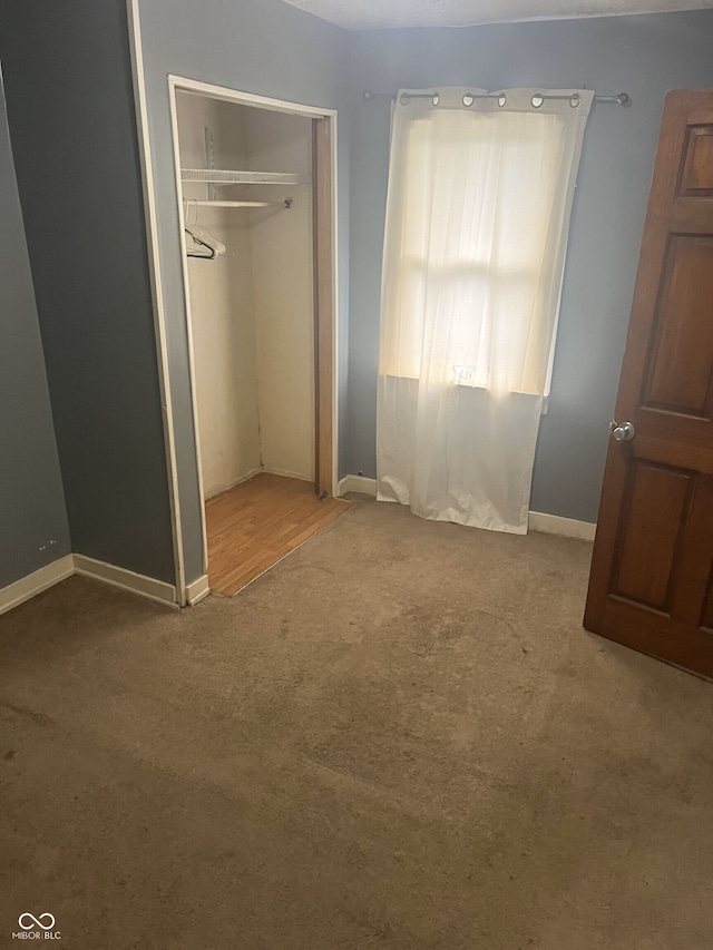 2146 Gent Ave, Indianapolis, IN 46202 - unfurnished bedroom featuring carpet floors, baseboards, and a closet