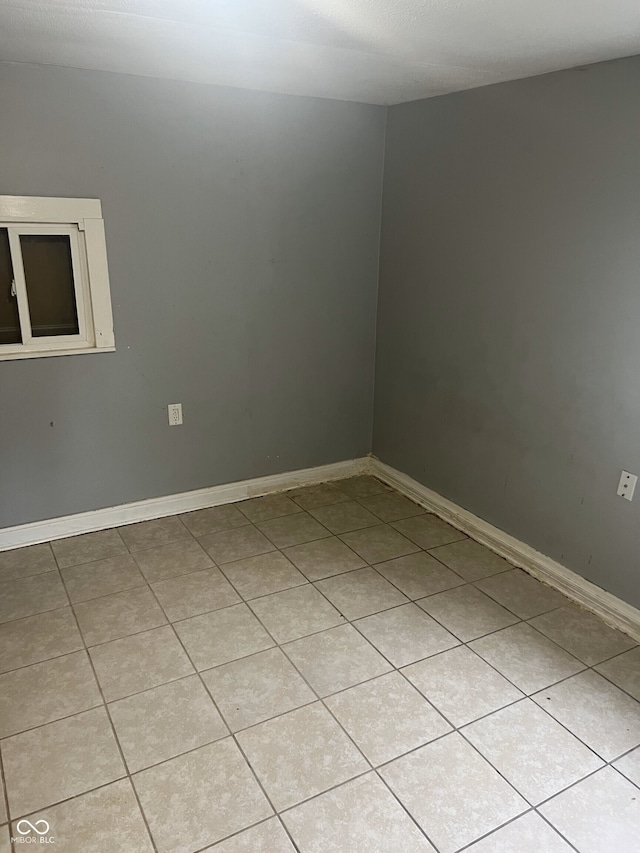 2146 Gent Ave, Indianapolis, IN 46202 - empty room featuring light tile patterned flooring and baseboards