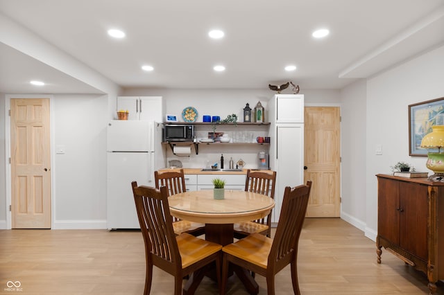 17216 W Hunnicut Rd, Cambridge City, IN 47327 - dining space with light wood-style flooring and recessed lighting
