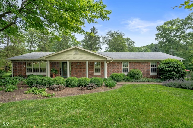 17216 W Hunnicut Rd, Cambridge City, IN 47327 - ranch-style house with a front yard and brick siding