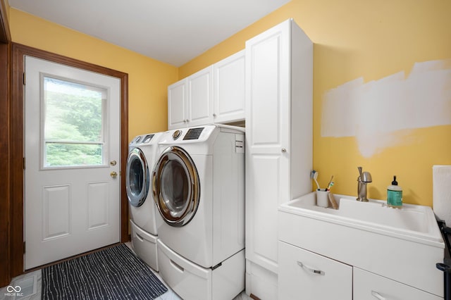 17216 W Hunnicut Rd, Cambridge City, IN 47327 - laundry room with washing machine and dryer and cabinet space
