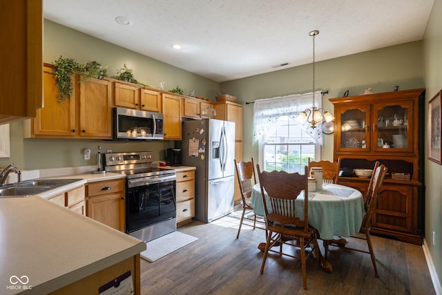 8133 Hazen Way, Indianapolis, IN 46216 - kitchen with stainless steel appliances, a sink, light countertops, wood finished floors, and recessed lighting
