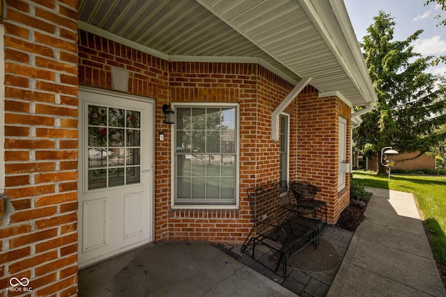 8133 Hazen Way, Indianapolis, IN 46216 - view of exterior entry featuring brick siding and a patio area