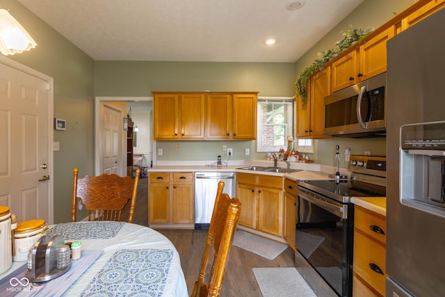 8133 Hazen Way, Indianapolis, IN 46216 - kitchen with appliances with stainless steel finishes, a sink, dark wood-style floors, light countertops, and recessed lighting