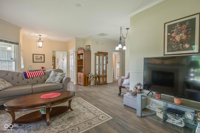 8133 Hazen Way, Indianapolis, IN 46216 - living room with ornamental molding, wood finished floors, and a chandelier