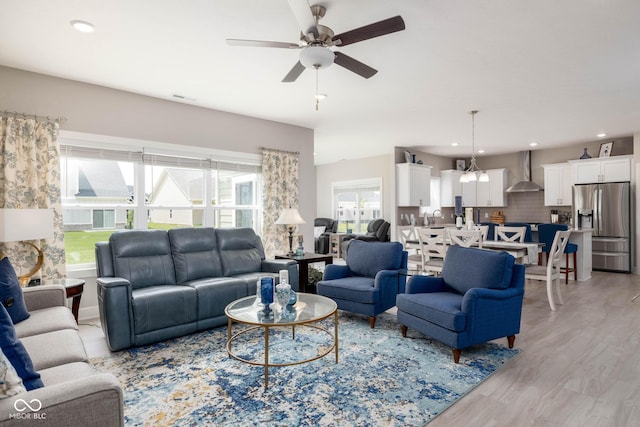 3622 S Setting Sun Ln, New Palestine, IN 46163 - living room featuring light wood-style flooring and ceiling fan
