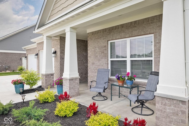 3622 S Setting Sun Ln, New Palestine, IN 46163 - view of patio featuring covered porch, an attached garage, and driveway