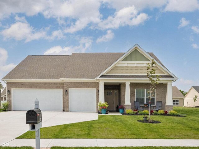 3622 S Setting Sun Ln, New Palestine, IN 46163 - craftsman-style house with a garage, concrete driveway, a front yard, and brick siding