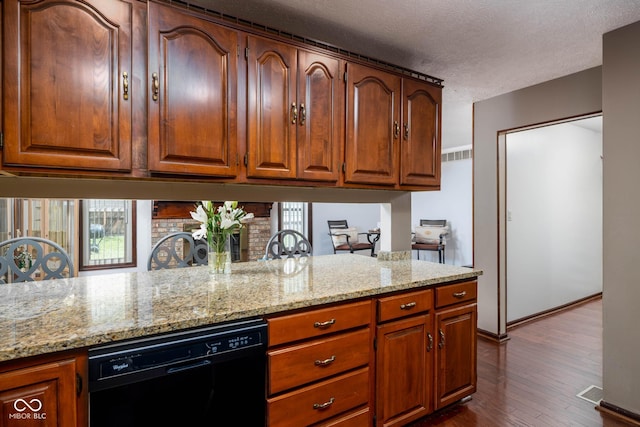 16226 Montrose Ln, Westfield, IN 46074 - kitchen with dishwasher, light stone counters, dark wood-style floors, a textured ceiling, and brown cabinets