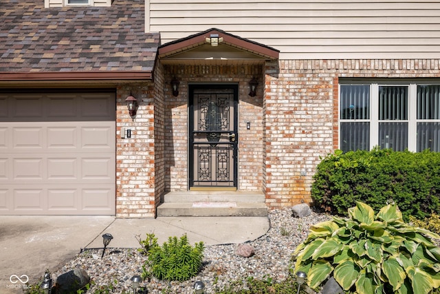 16226 Montrose Ln, Westfield, IN 46074 - entrance to property featuring brick siding, concrete driveway, and an attached garage