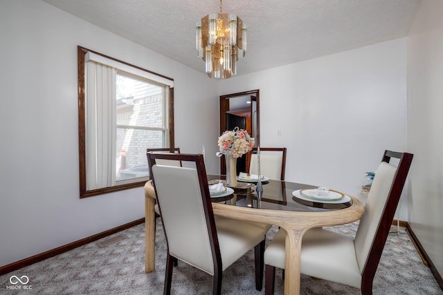 16226 Montrose Ln, Westfield, IN 46074 - carpeted dining space featuring a chandelier, baseboards, and a textured ceiling