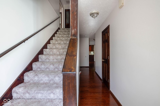 16226 Montrose Ln, Westfield, IN 46074 - stairway with wood finished floors, baseboards, and a textured ceiling