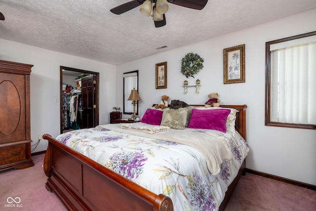 16226 Montrose Ln, Westfield, IN 46074 - carpeted bedroom featuring baseboards, a textured ceiling, a closet, a spacious closet, and a ceiling fan