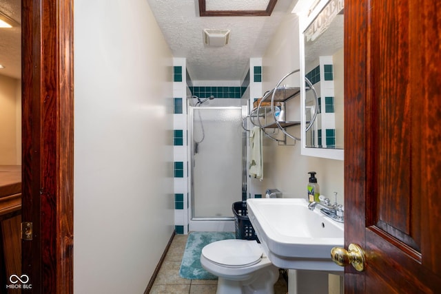 16226 Montrose Ln, Westfield, IN 46074 - full bath featuring a stall shower, a textured ceiling, toilet, tile patterned flooring, and baseboards