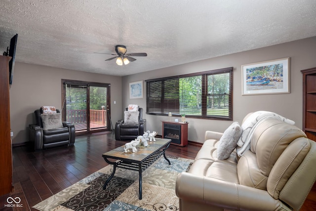 16226 Montrose Ln, Westfield, IN 46074 - living room with a ceiling fan, a textured ceiling, wood finished floors, and baseboards