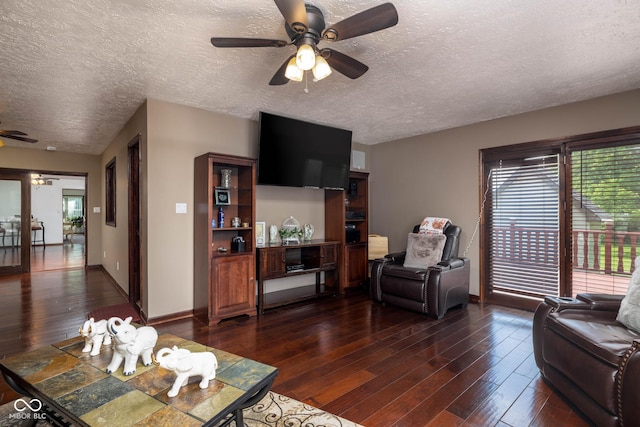 16226 Montrose Ln, Westfield, IN 46074 - living room with a ceiling fan, dark wood finished floors, a textured ceiling, and baseboards